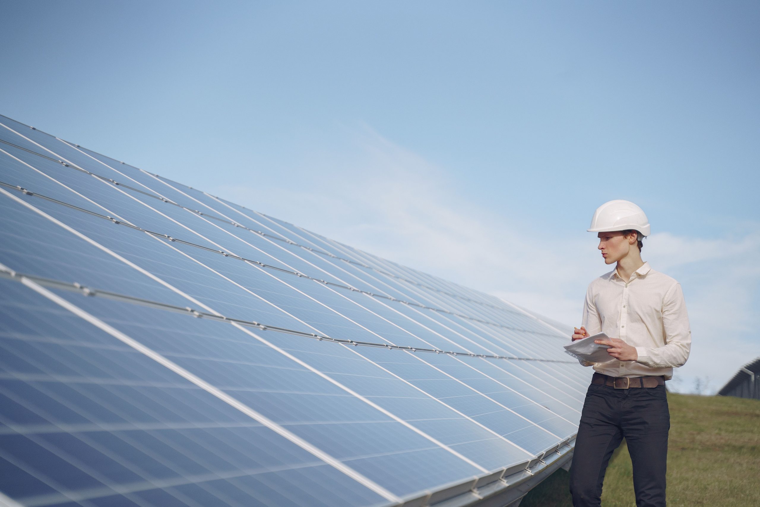 Engineer inspecting an on-site solar array